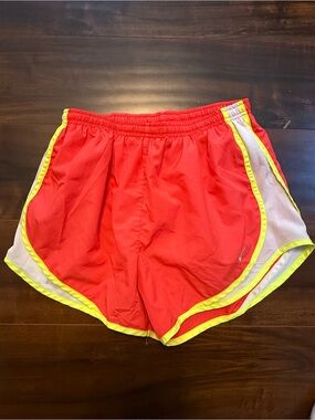 Nike Women's Red Athletic Shorts with Yellow Trim